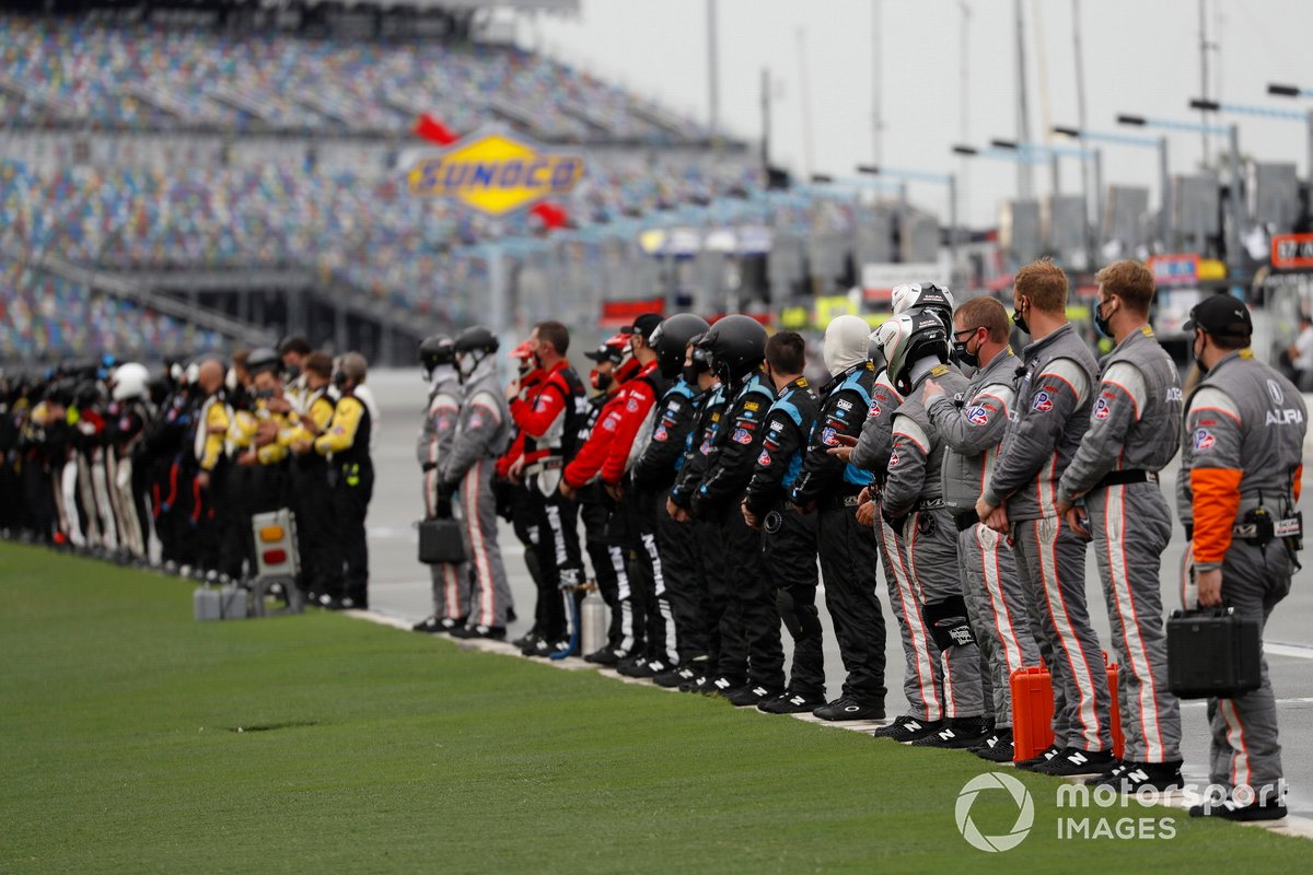 The teams salute the field