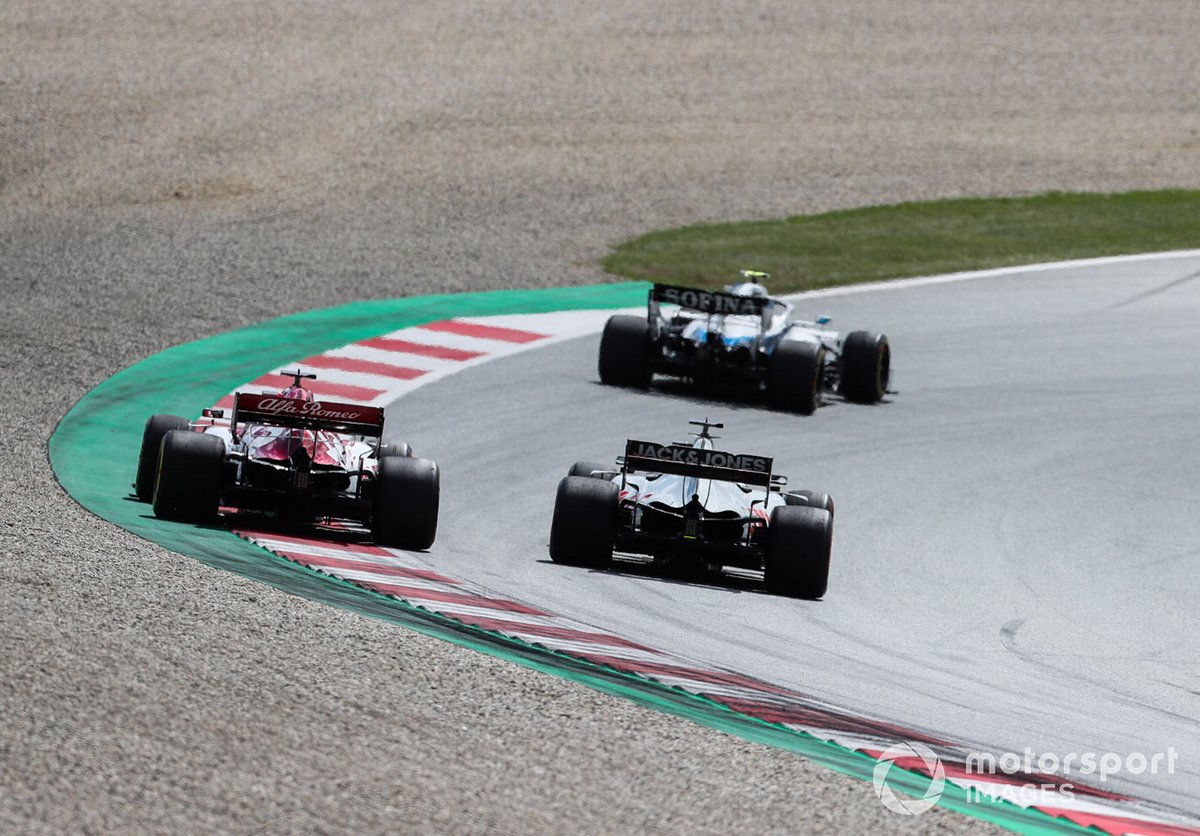 Nicholas Latifi, Williams FW43, leads Romain Grosjean, Haas VF-20, and Kimi Raikkonen, Alfa Romeo Racing C39