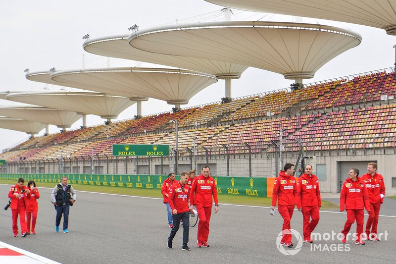 Sebastian Vettel, Ferrari walks the track with his team