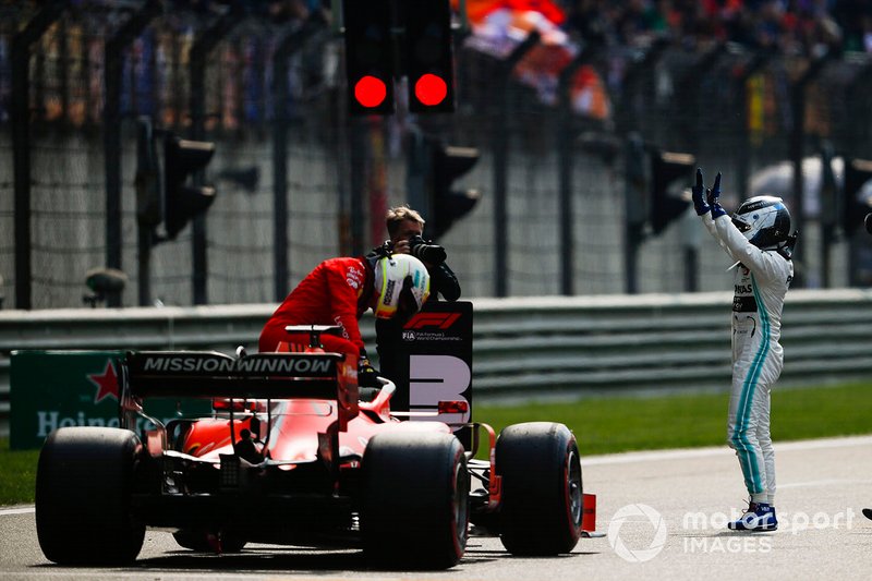 Valtteri Bottas, Mercedes AMG F1, celebrates pole as Sebastian Vettel, Ferrari SF90, arrives on the grid
