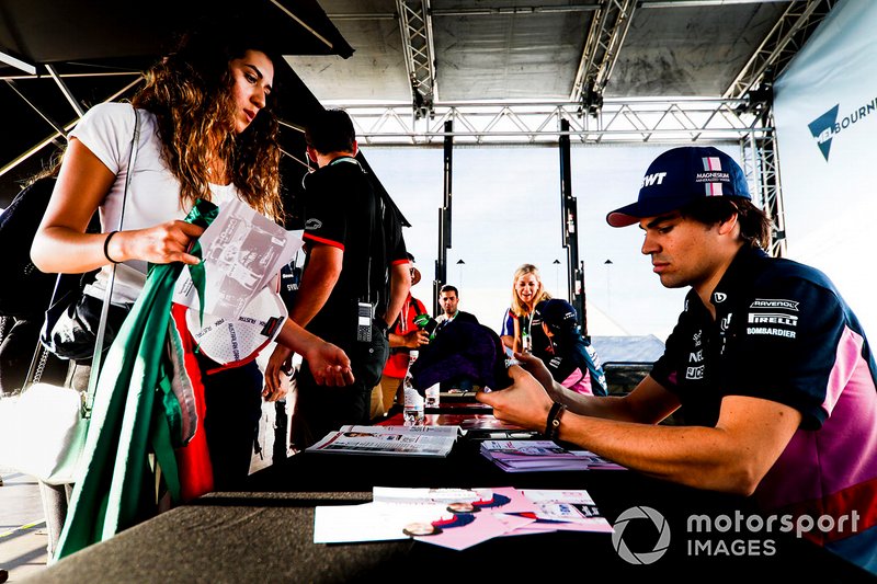 Lance Stroll, Racing Point signs a autograph for a fan
