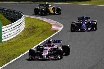 Esteban Ocon, Racing Point Force India VJM11, leads Brendon Hartley, Toro Rosso STR13, and Carlos Sainz Jr., Renault Sport F1 Team R.S. 18