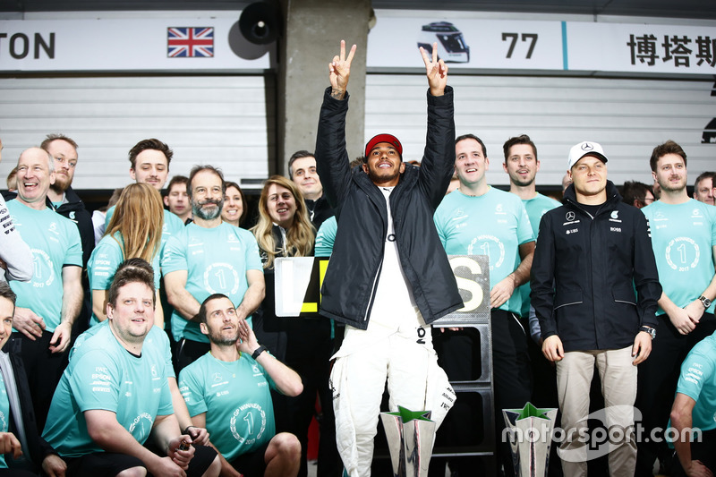 Lewis Hamilton, Mercedes AMG, celebrates with his team after the race