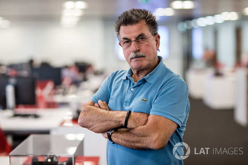 Rainer W. Schlegelmilch poses in the Motorsport Network office