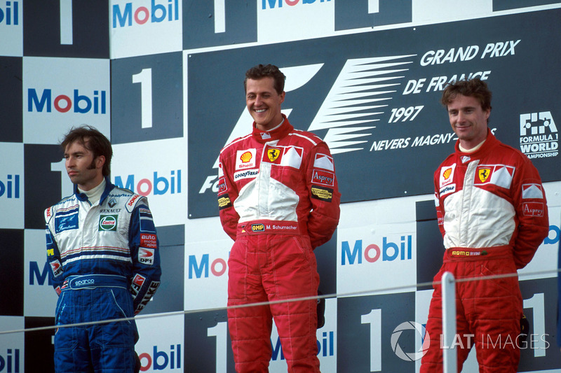 Podium: Race winner Michael Schumacher, Ferrari, second place Heinz-Harald Frentzen, Williams, third place Eddie Irvine, Ferrari