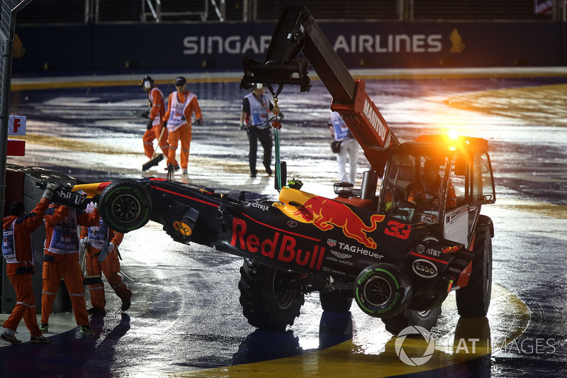 The car of Max Verstappen, Red Bull Racing RB13 is recovered by Marshals after crashing out at the s