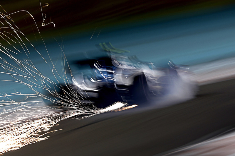 Sparks fly from the car of Valtteri Bottas, Williams FW38