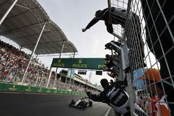 Sergio Perez, Sahara Force India F1 celebrates his third position at the end of the race as he passes his team on the pit wall