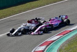 Charles Leclerc, Sauber C37 and Sergio Perez, Force India VJM11