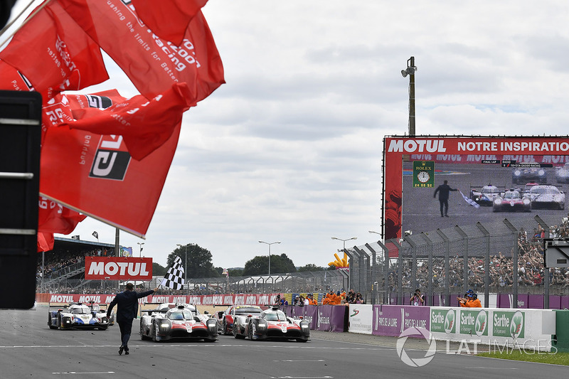Winners #8 Toyota Gazoo Racing Toyota TS050: Sébastien Buemi, Kazuki Nakajima, Fernando Alonso cross the finish line
