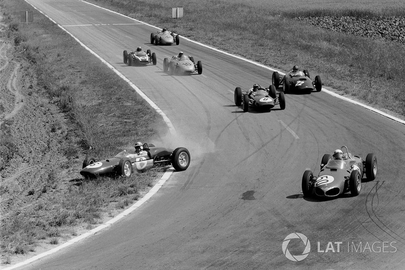 Giancarlo Baghetti leads in the Ferrari 156, while Lotus 21 driver Innes Ireland gets it crossed up