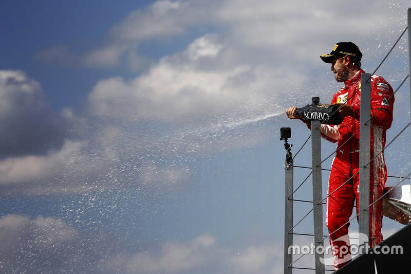 Race winner Sebastian Vettel, Ferrari celebrates on the podium