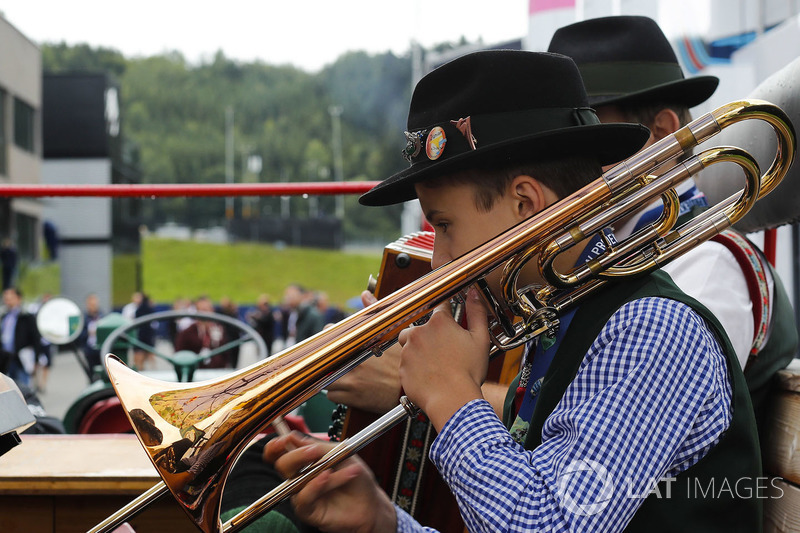 Musicians play in the paddock