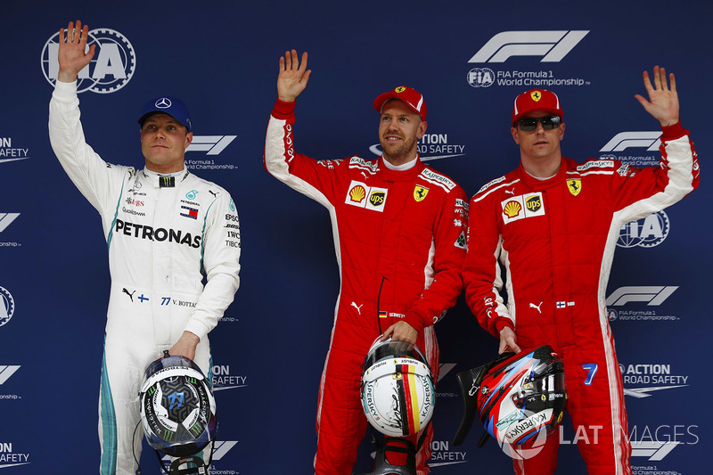 Polesitter Sebastian Vettel, Ferrari, second place Kimi Raikkonen, Ferrari, third place Valtteri Bottas, Mercedes AMG F1