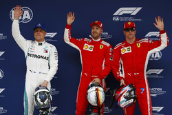Polesitter Sebastian Vettel, Ferrari, second place Kimi Raikkonen, Ferrari, third place Valtteri Bottas, Mercedes AMG F1