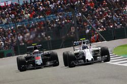 Valtteri Bottas, Williams FW38 leads Jenson Button, McLaren MP4-31