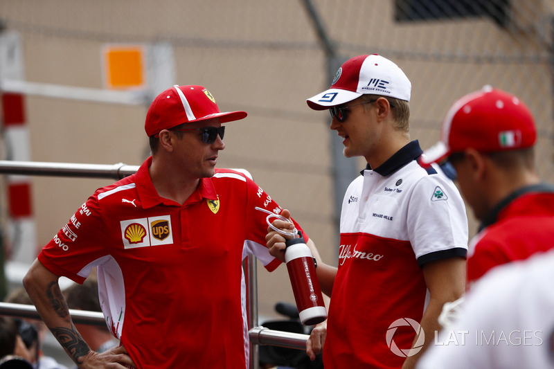 Kimi Raikkonen, Ferrari, and Marcus Ericsson, Sauber