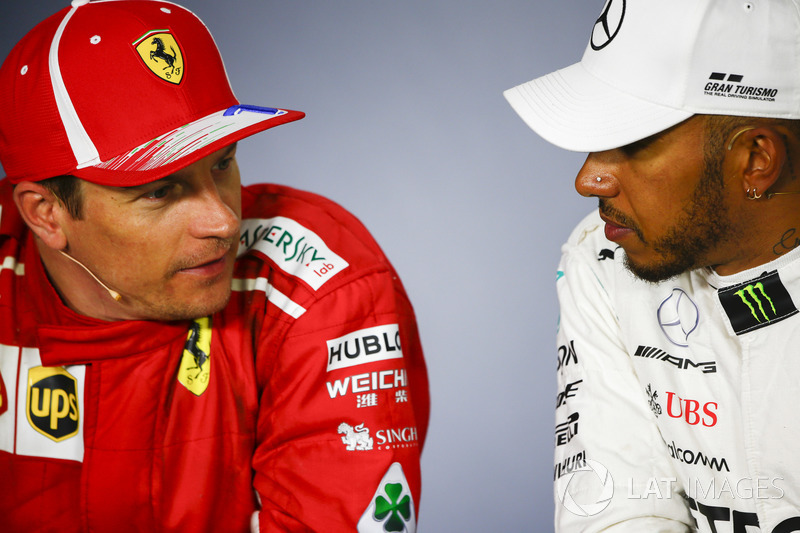 Kimi Raikkonen, Ferrari, 2nd position, and Lewis Hamilton, Mercedes AMG F1, 1st position, talk in the Press Conference