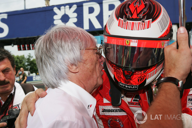 Kimi Raikkonen, Ferrari, talks to Bernie Ecclestone