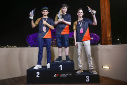 Brendon Leigh celebrates on the podium after winning the E-Sports event