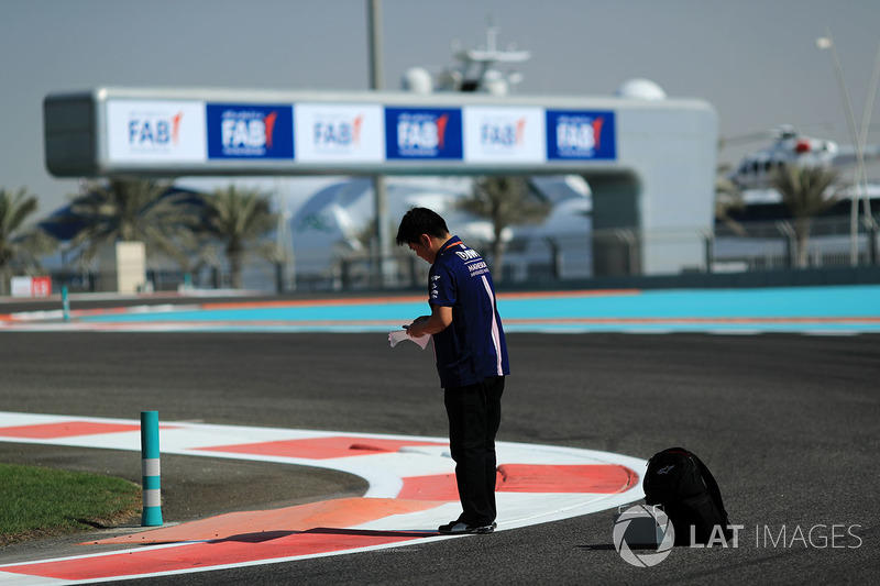 Jun Matsuzaki, Sahara Force India F1 Team Senior Tyre Engineer makes notes on track
