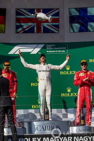 Sebastian Vettel, Ferrari, Lewis Hamilton, Mercedes-AMG F1 and Kimi Raikkonen, Ferrari celebrate on the podium
