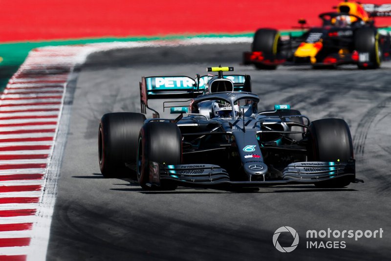 Valtteri Bottas, Mercedes AMG W10, leads Max Verstappen, Red Bull Racing RB15