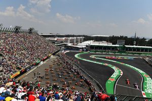 Kimi Raikkonen, Ferrari SF71H and Esteban Ocon, Racing Point Force India VJM11