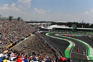 Kimi Raikkonen, Ferrari SF71H and Esteban Ocon, Racing Point Force India VJM11 