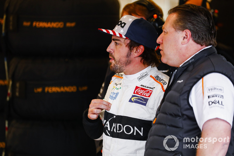 Fernando Alonso, McLaren, and Zak Brown, Executive Director, McLaren Racing, in the garage