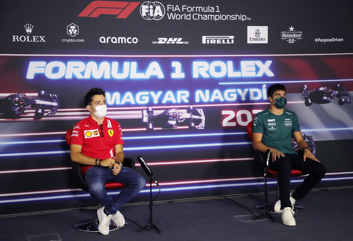 Charles Leclerc, Ferrari and Lance Stroll, Aston Martin