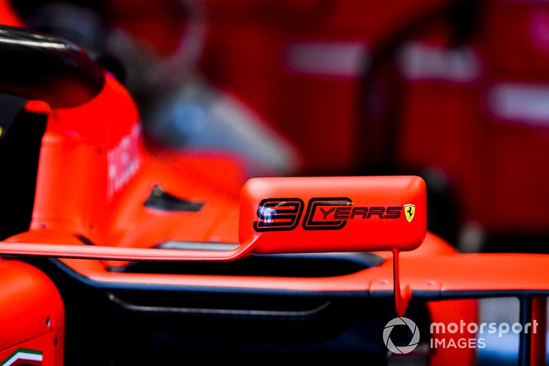 90 years logo on the mirror of a Ferrari SF90