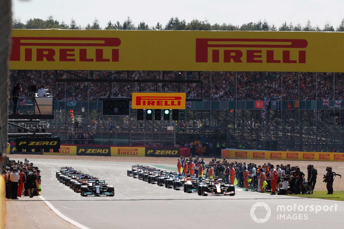 Max Verstappen, Red Bull Racing RB16B, and Lewis Hamilton, Mercedes W12, prepare to lead the field away for the fomeation lap