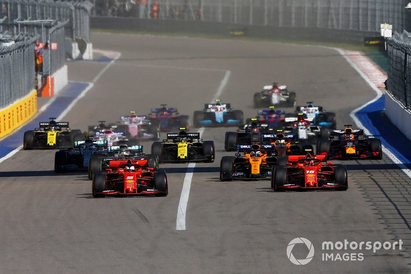 Sebastian Vettel, Ferrari SF90, leads Charles Leclerc, Ferrari SF90 at the start of the race
