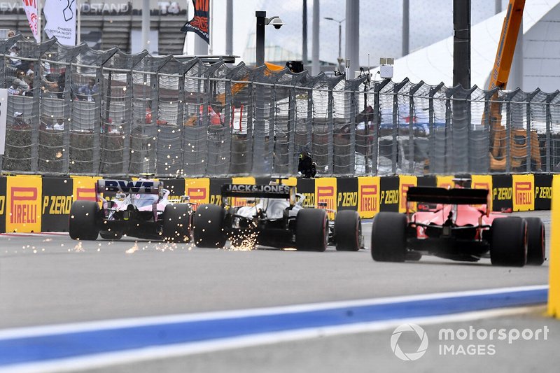 Lance Stroll, Racing Point RP19, Romain Grosjean, Haas F1 Team VF-19, y Sebastian Vettel, Ferrari SF90