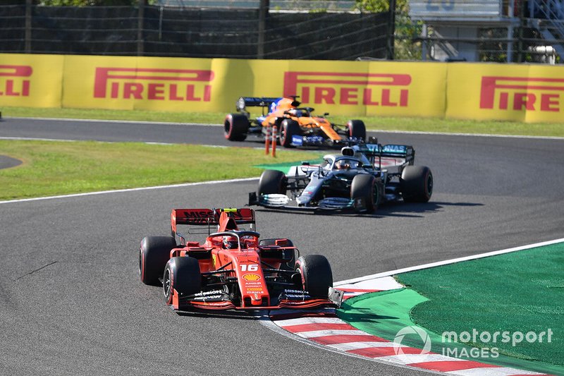 Charles Leclerc, Ferrari SF90, leads Lewis Hamilton, Mercedes AMG F1 W10, and Carlos Sainz Jr., McLaren MCL34