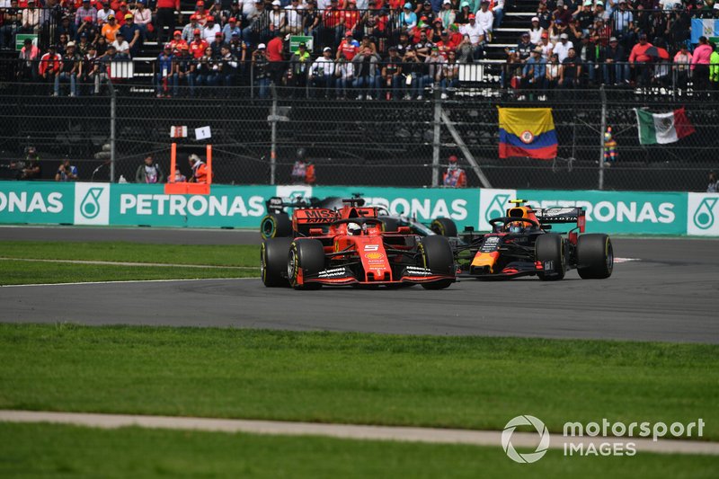 Sebastian Vettel, Ferrari SF90, leads Alexander Albon, Red Bull RB15