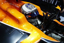 Fernando Alonso, McLaren, puts on his gloves in his cockpit