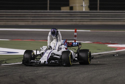 Lance Stroll, Williams FW40, climbs out of his damaged car after a collision with Carlos Sainz Jr.,