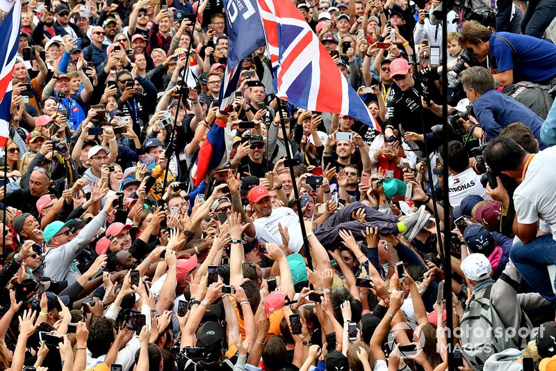 Lewis Hamilton, Mercedes AMG F1, 1st position, celebrates by crowd surfing over fans