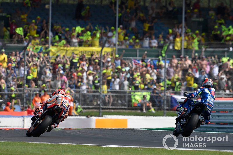 Alex Rins, Team Suzuki MotoGP, wins, Marc Marquez, Repsol Honda Team` with hand on his head