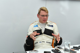 Mika Hakkinen talks with the media at Legends F1 30th Anniversary Lap Demonstration