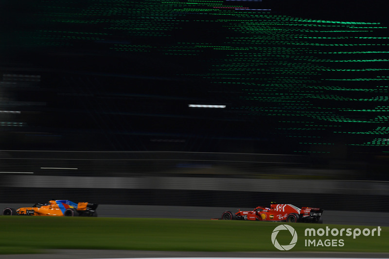 Fernando Alonso, McLaren MCL33 and Kimi Raikkonen, Ferrari SF71H