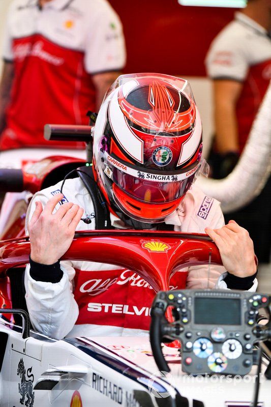Kimi Raikkonen, Alfa Romeo Racing, drops in to his seat