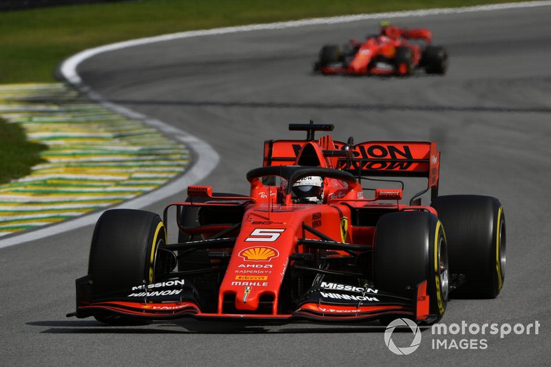 Sebastian Vettel, Ferrari SF90, leads Charles Leclerc, Ferrari SF90