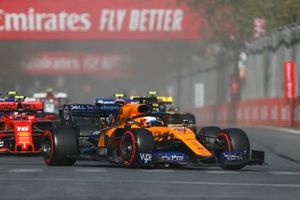 Carlos Sainz Jr., McLaren MCL34, leads Lance Stroll, Racing Point RP19, Charles Leclerc, Ferrari SF90, and the remainder of the field