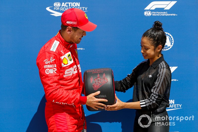 Sebastian Vettel, Ferrari, is presented with his Pirelli Pole Position Award by actress Liza Koshy