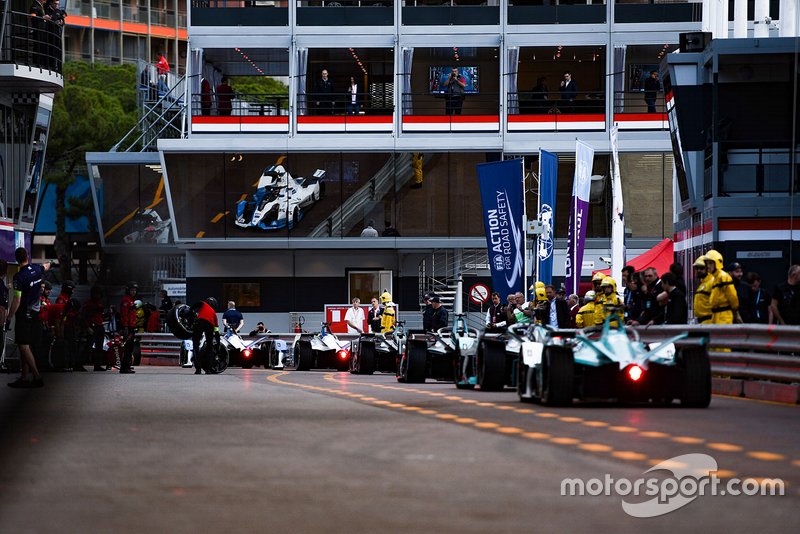 Cars line up at pit exit