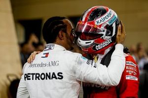 Lewis Hamilton, Mercedes AMG F1, 1st position, talks with Charles Leclerc, Ferrari, 3rd position, in Parc Ferme