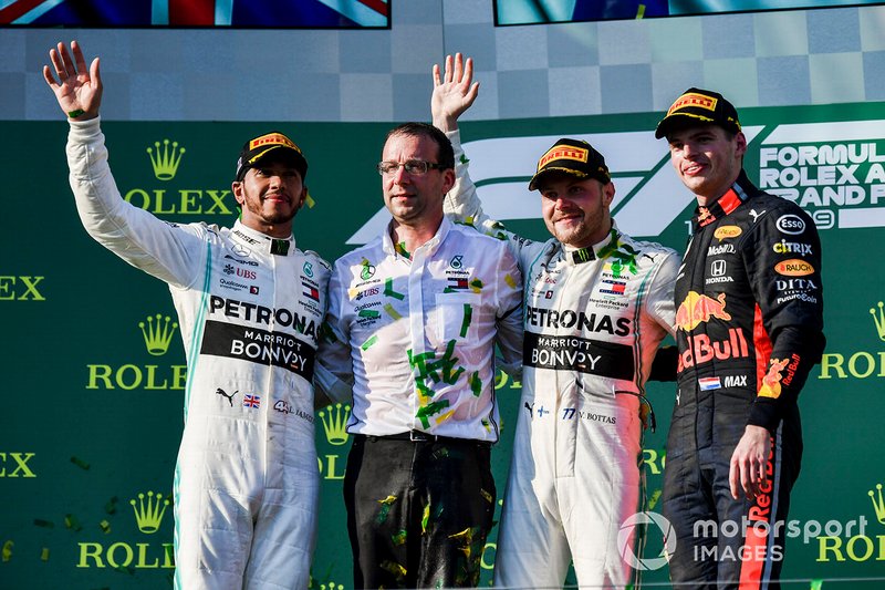 Lewis Hamilton, Mercedes AMG F1, 2nd position, the Mercedes Constructors delegate, Valtteri Bottas, Mercedes AMG F1, 1st position, and Max Verstappen, Red Bull Racing, 3rd position, on the podium